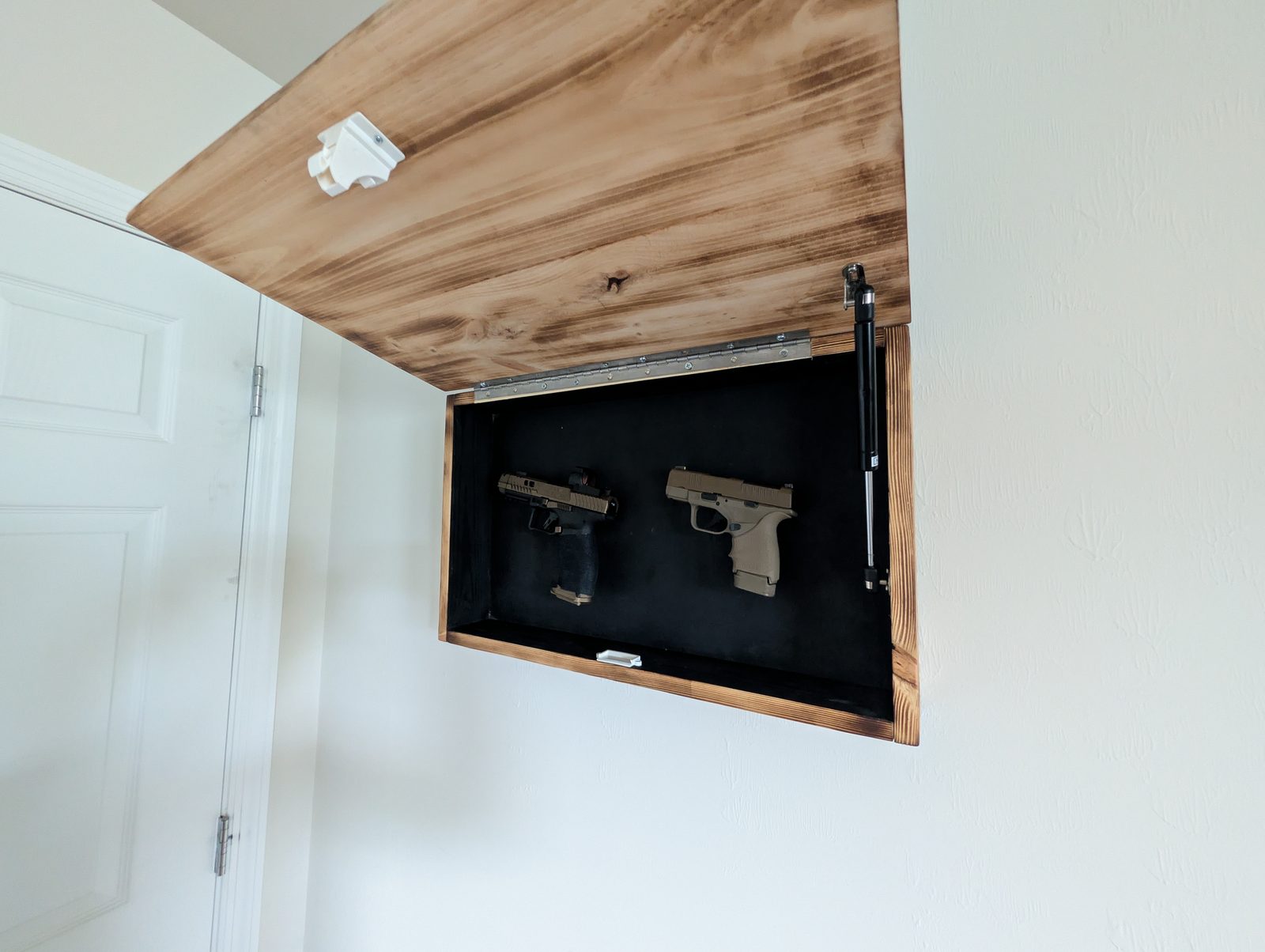 Side profile — depth of the hidden compartment behind the sign